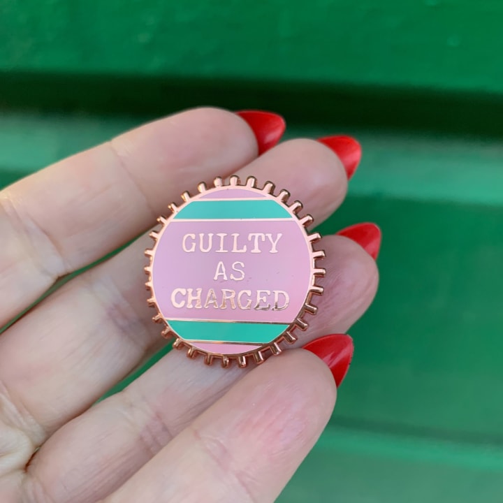 Guilty As Charged Pink and Mint Enamel Pin on Gift Card