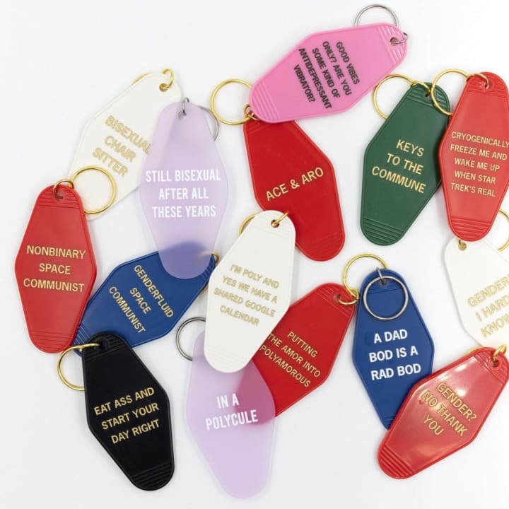 Nonbinary Space Communist Motel Style Keychain in Red and Gold