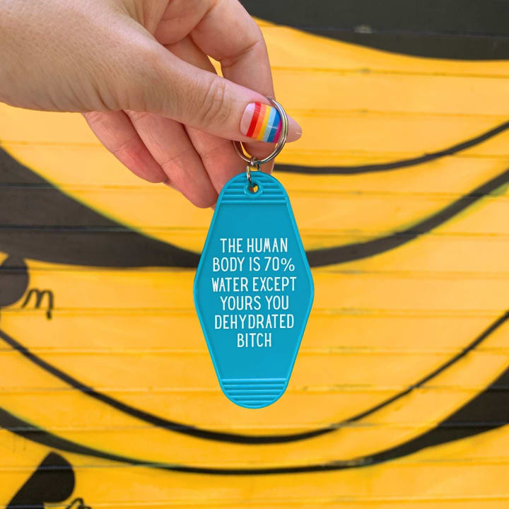 The Human Body is 70% Water Except Yours You Dehydrated B*tch Motel Style Keychain in Blue