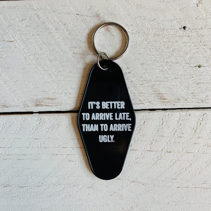 It's Better To Arrive Late, Than To Arrive Ugly Keychain in Black and White