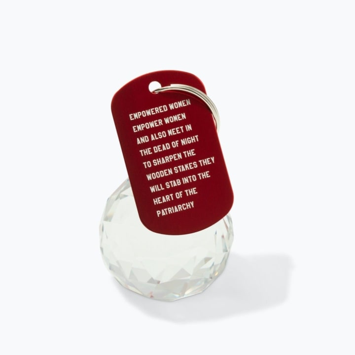 Empowered Women Empower Women And Also Meet in the Dead of Night Feminist Dog Tag Keychain in Red with Silver Lettering