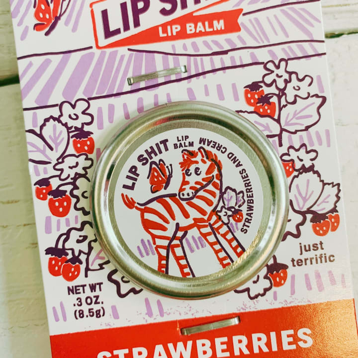 Lip Shit Lip Balm in Strawberries And Cream | Lip Moisturizer in Tin | .3oz | BlueQ at GetBullish