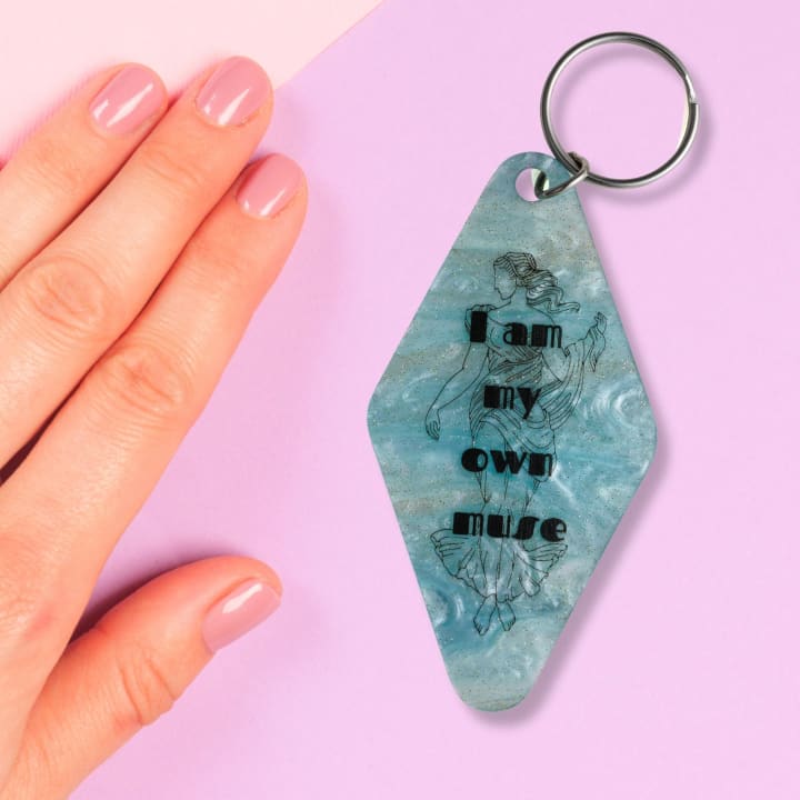 I Am My Own Muse Goddess Motel Keychain in Pearl Blue Marble