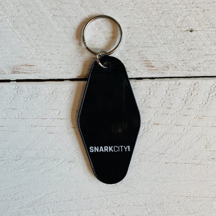 It's Better To Arrive Late, Than To Arrive Ugly Keychain in Black and White