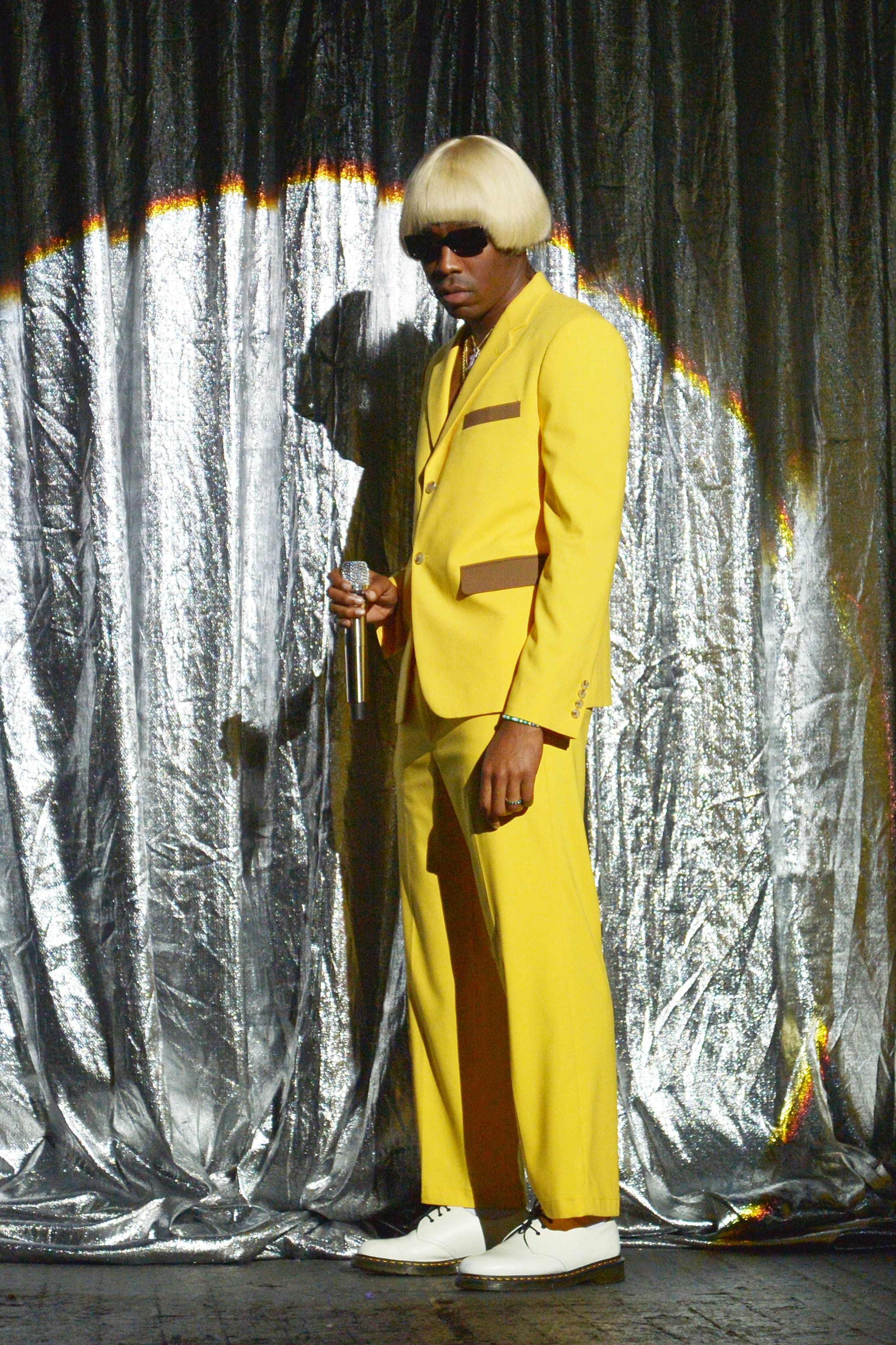 Tyler the Creator at the Grammys wearing Supreme Wool Overcoat, Louis  Vuitton Scarf & Converse Chuck Taylor All Star