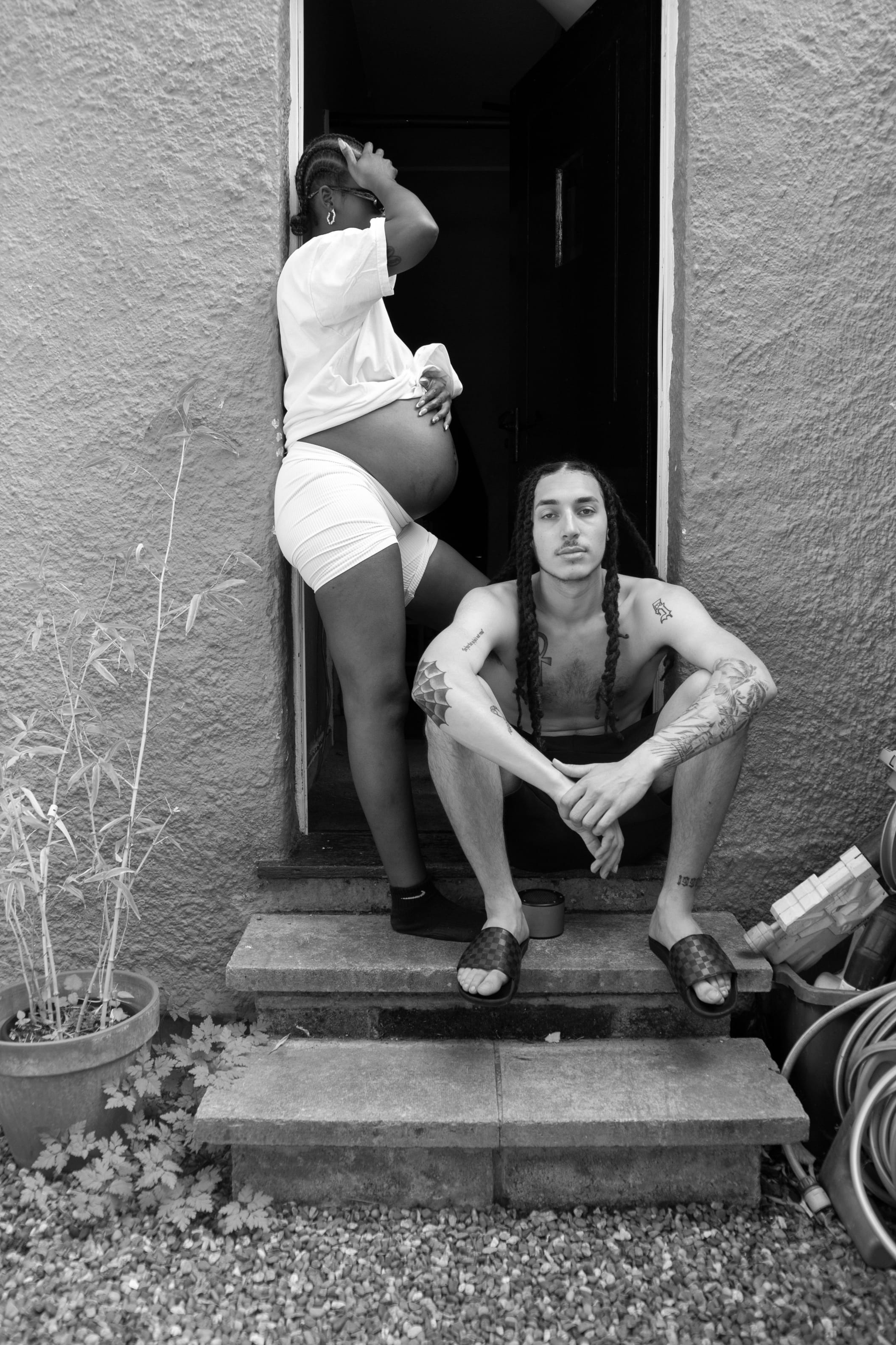 Young pregnant couple in black and white